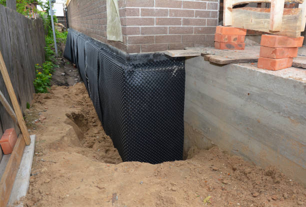 Happy homeowners after waterproofing job in Anderson